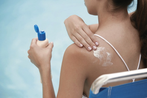 Woman Applying Sunscreen