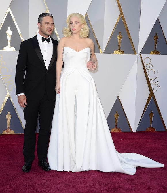 Lady Gaga (R) and Taylor Kinney