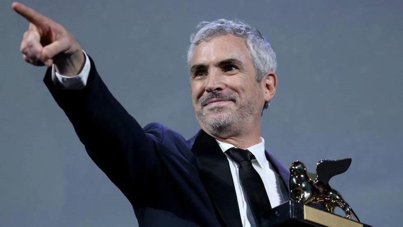 Alfonso Cuar&oacute;n con su Le&oacute;n e Oro 2018