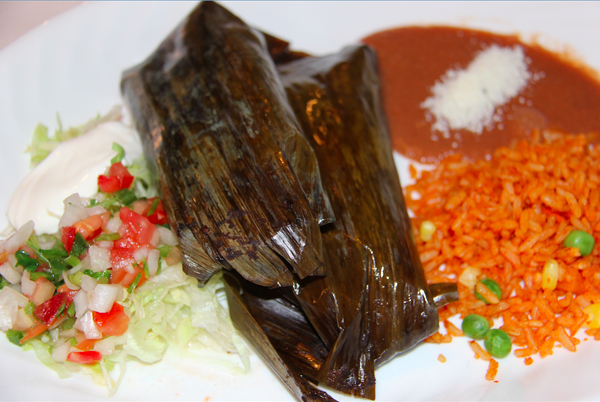 El tamal es otro bocadillo panamericano que en cada pa&iacute;s, regi&oacute;n, ciudad y familia, tiene su toque particular, como este tamal de Oaxaca, que se prepara con hoja de pl&aacute;tano en lugar de la tradicional hoja de ma&iacute;z.