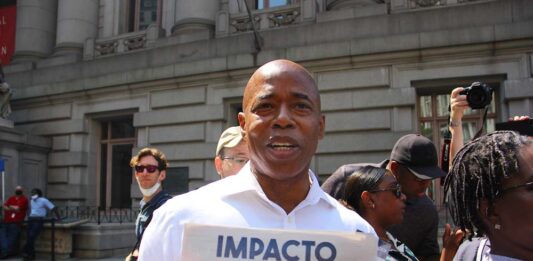 ERIC ADAMS HOLDING IMPACTO