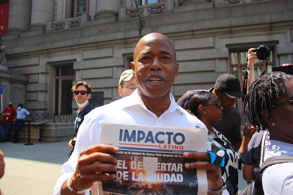 ERIC ADAMS HOLDING IMPACTO