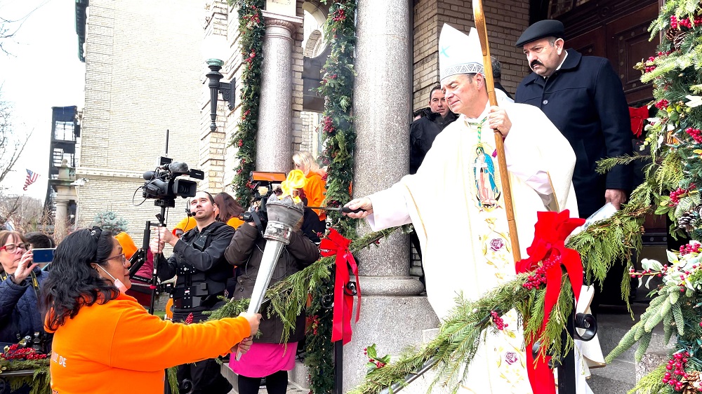 Bishop_Brennan_ lights_torch.