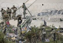 Autoridades disuelven campamento de migrantes en la frontera de México con EE.UU. La Guardia Nacional de Estados Unidos retira un campamento de migrantes (1)