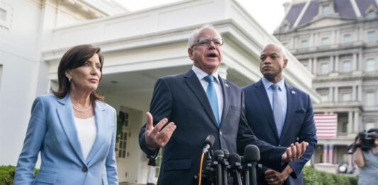 Tim Walz (C), New York Governor Kathy Hochul (L) and Maryland Governor Wes Moore