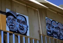 un mural con rostros de veteranos de guerra deportados, en el muro fronterizo de la ciudad de Tijuana (3)