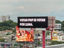 valla publicitaria que lee 'Votar PNP es votar por LUMA'