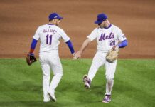 Mets players Jose Iglesias (L) and Pete Alonso