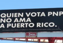 valla publicitaria con el mensaje 'Quien vota PNP no ama a Puerto Rico', atribuida a Bad Bunny