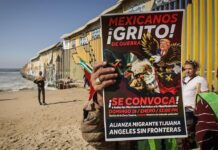 Migrantes y activistas se manifiestan en mexicana Tijuana ante toma de protesta de Trump