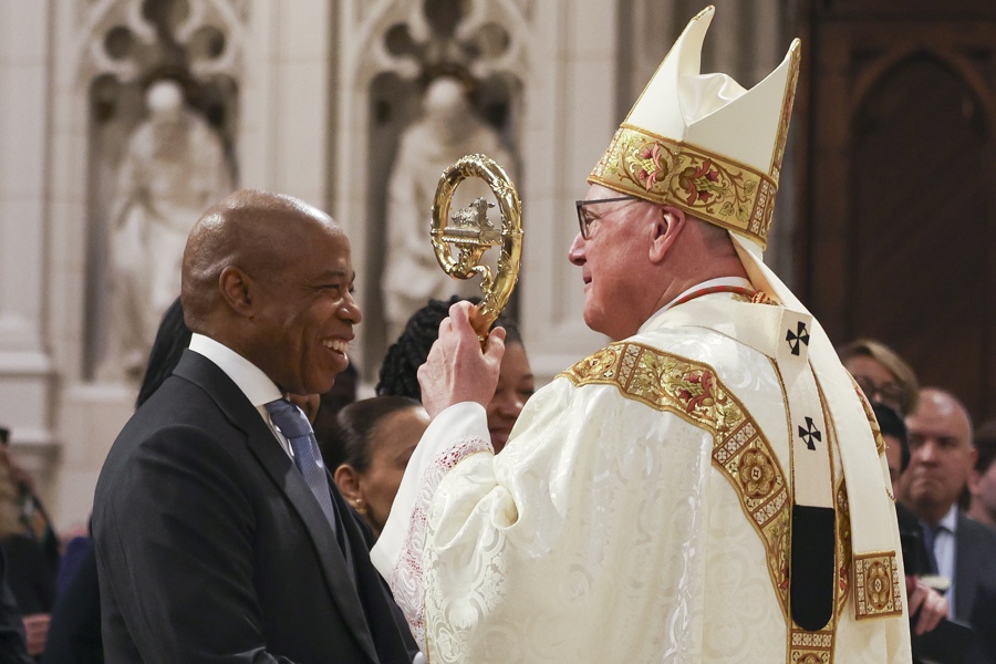 Timothy Dolan (R) greets New York City Mayor Eric Adams