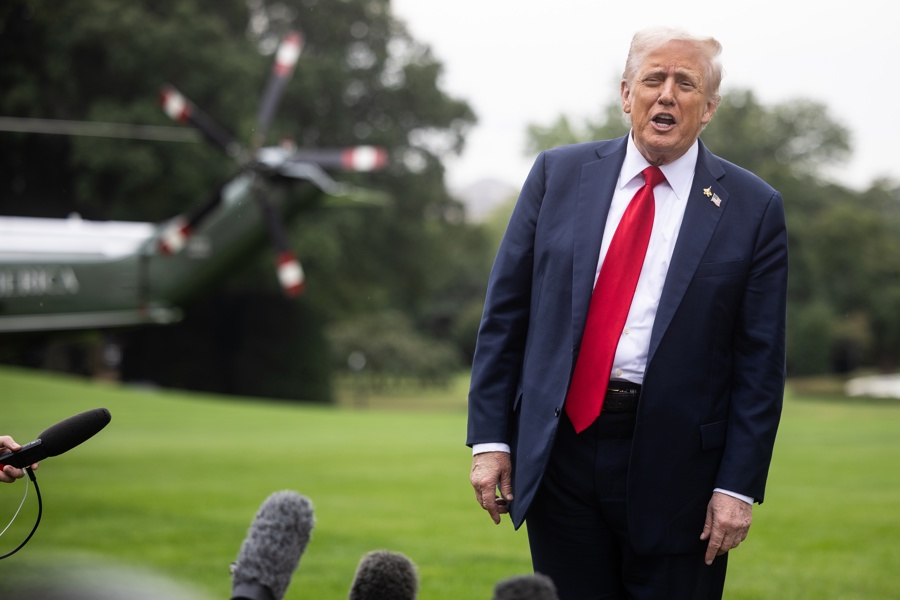 Trump speaks with reporters at the White House Trump