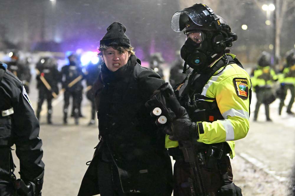People protest after fatal shooting of man by federal agents