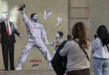 Un grafiti de Bad Bunny en el centro de Barcelona reivindica la paz frente a Trump