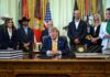 US President Donald Trump signs executive order at the White House