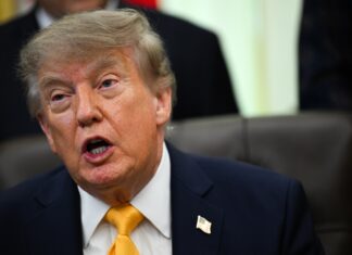 US President Donald Trump signs executive order at the White House
