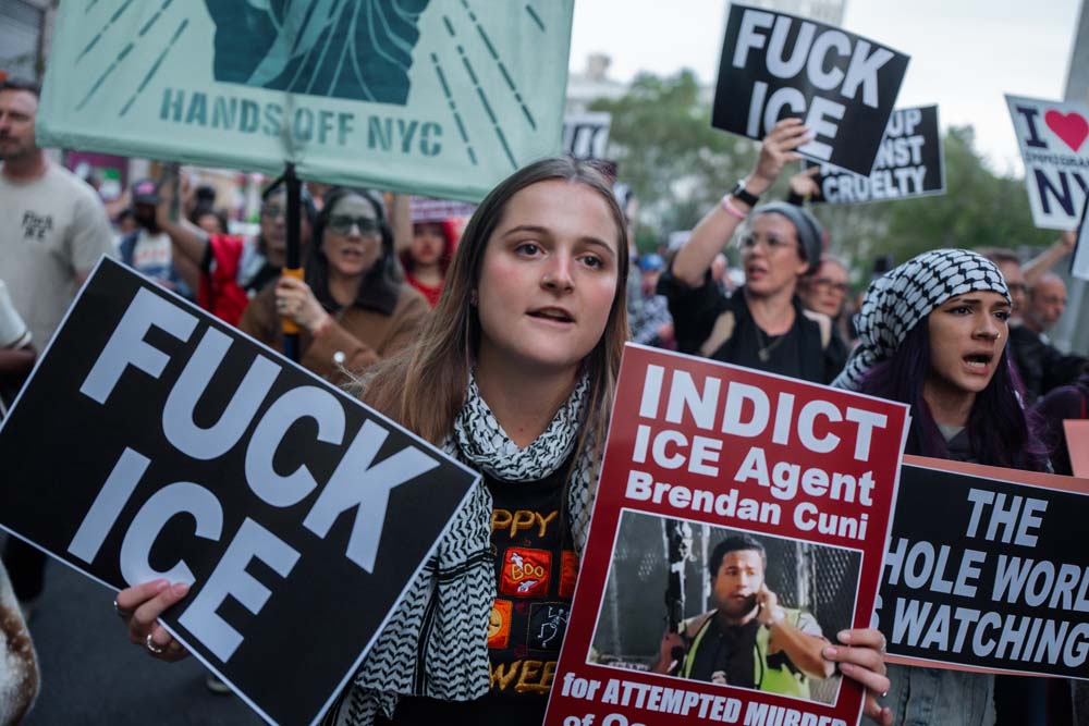 People rally against ICE after New York City shooting